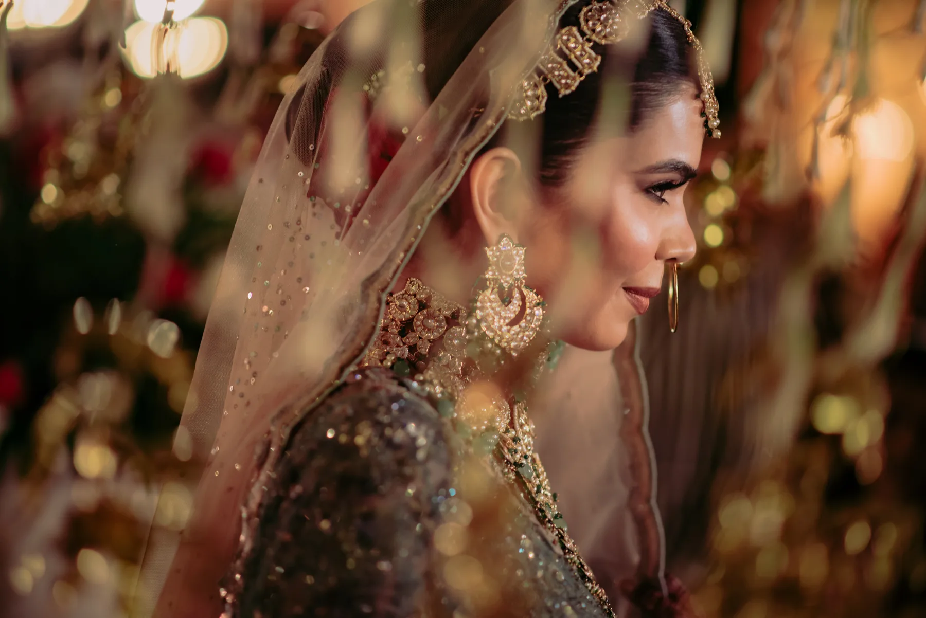 Couple beneath the veil in warm light